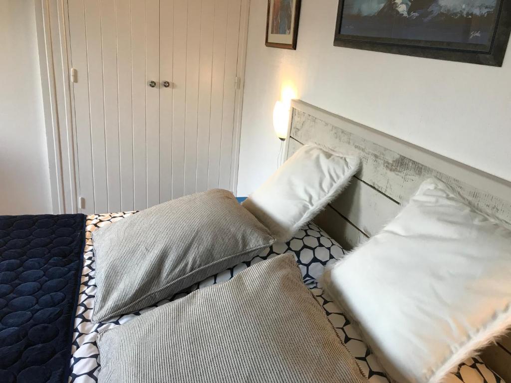 two beds sitting next to each other in a bedroom at Les Yeux Bleus Bed &amp; Breakfast in Noirmoutier-en-l&#39;lle