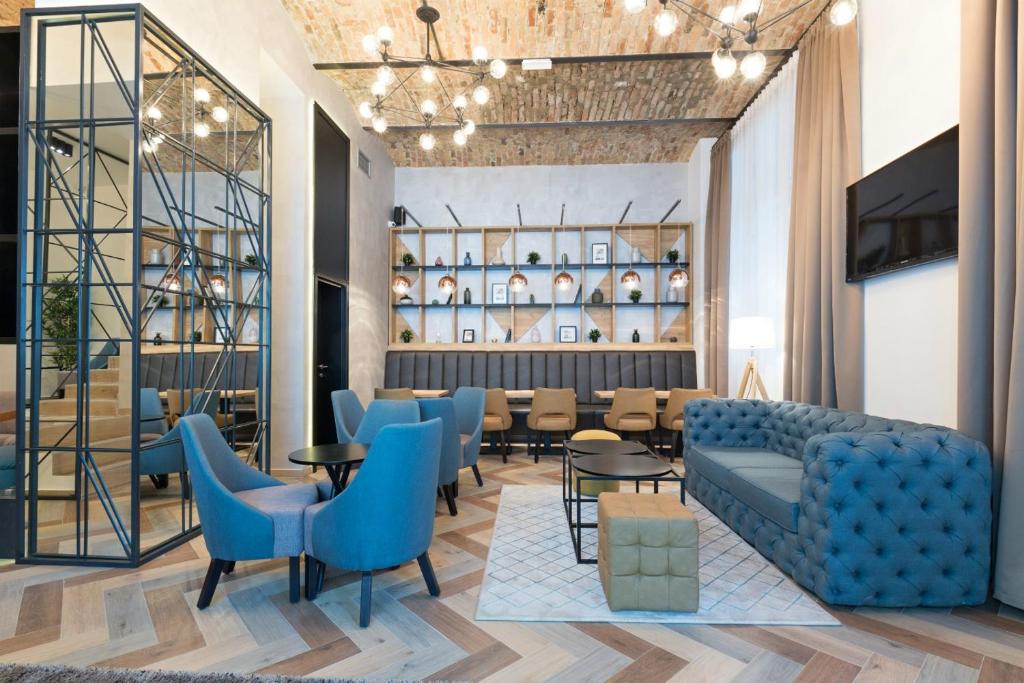 Posezení v ubytování Capital Hotel Garni