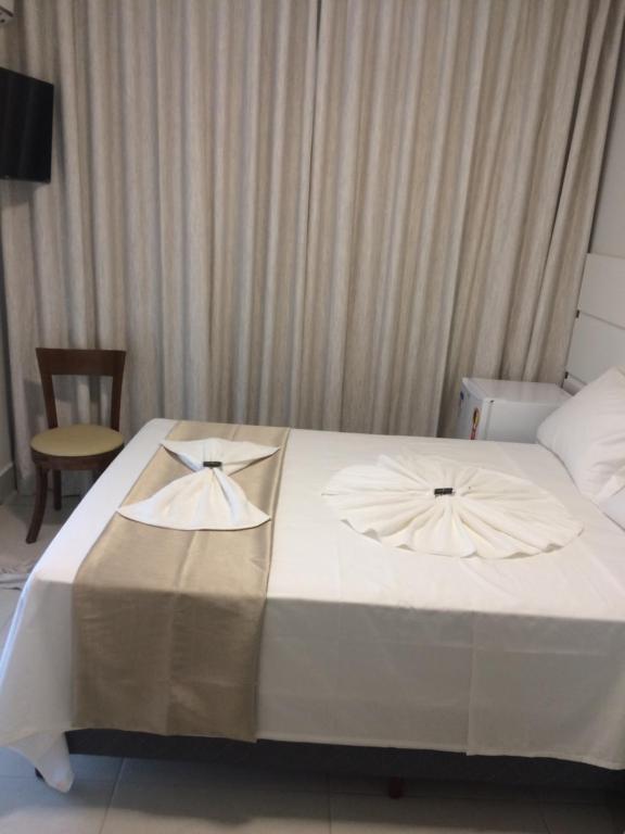 Postel nebo postele na pokoji v ubytování Hotel Portal Guanambi