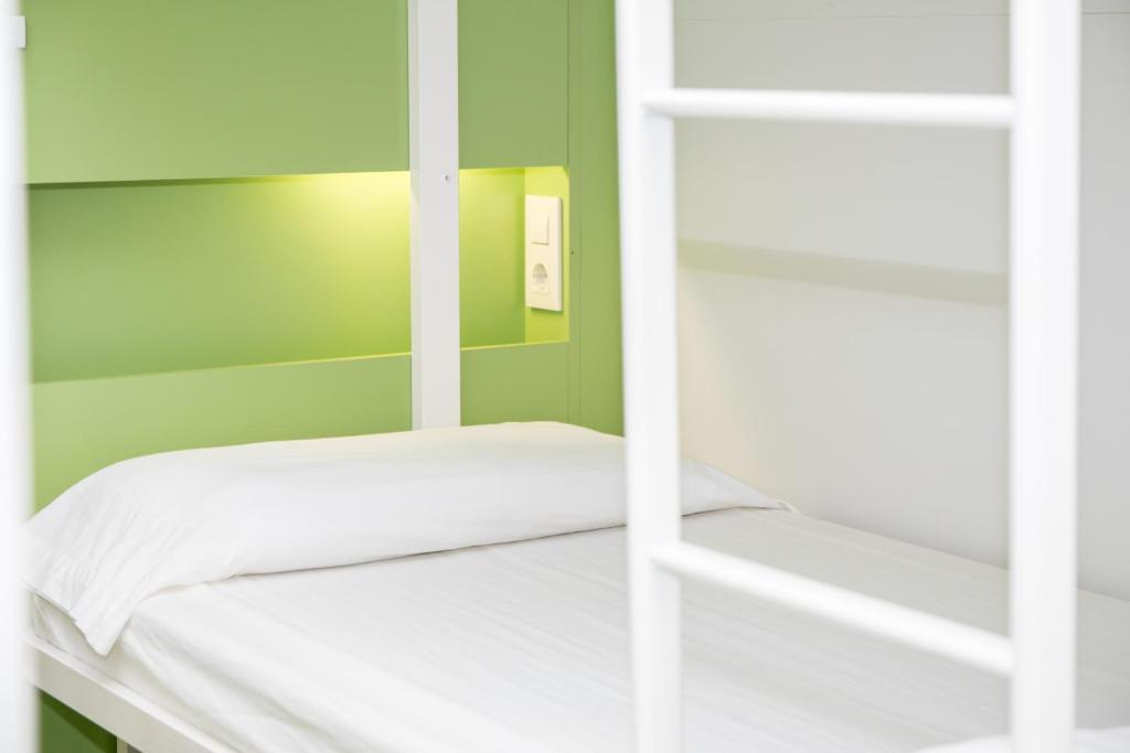 Cama ou camas em um quarto em Sant Jordi Hostels Sagrada Familia