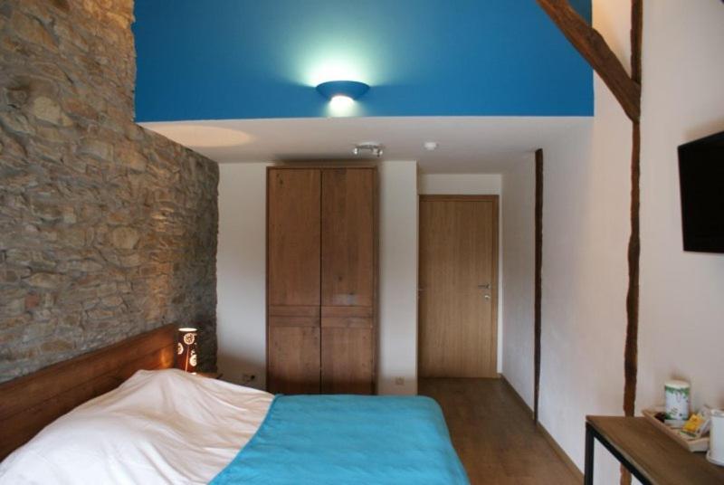 Postel nebo postele na pokoji v ubytování Auberge Le Temps des Saveurs