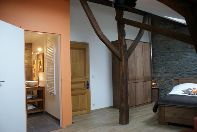Postel nebo postele na pokoji v ubytování Auberge Le Temps des Saveurs