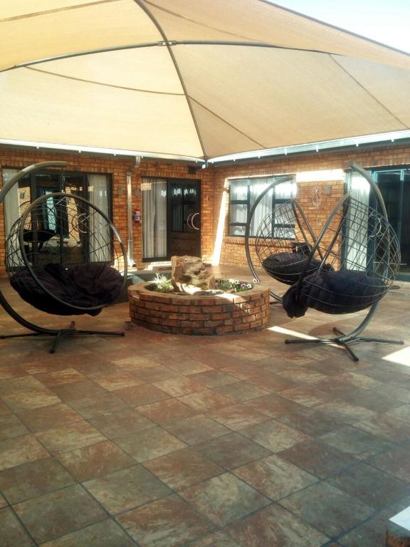 two helicopters on display in front of a building at The Green Olive Guesthouse in Bethlehem