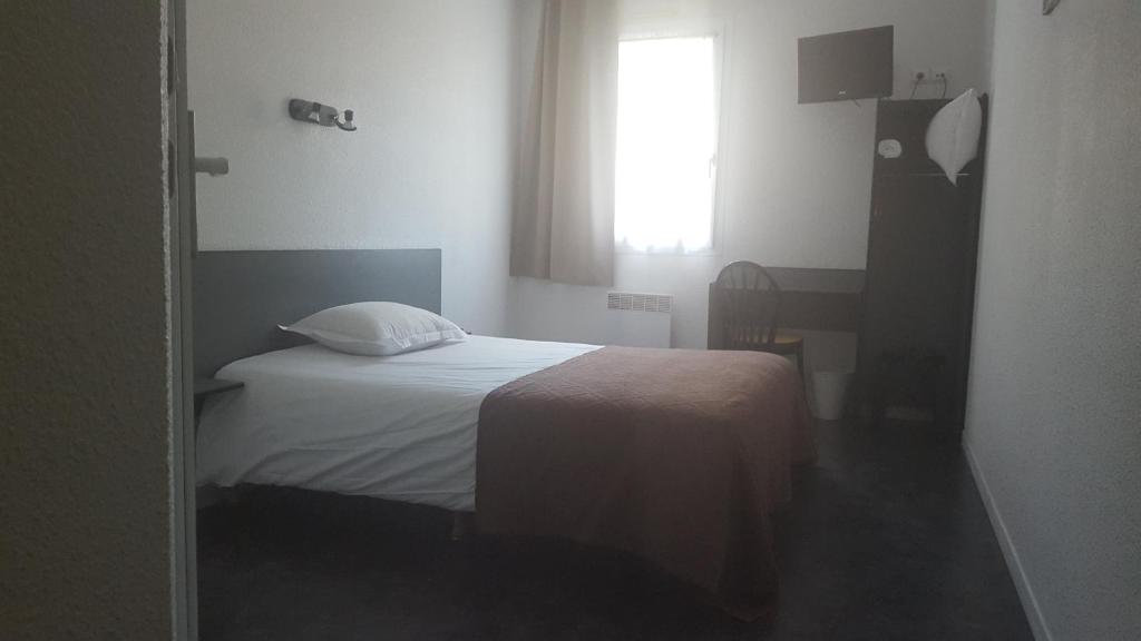 Postel nebo postele na pokoji v ubytování Relax Hotel
