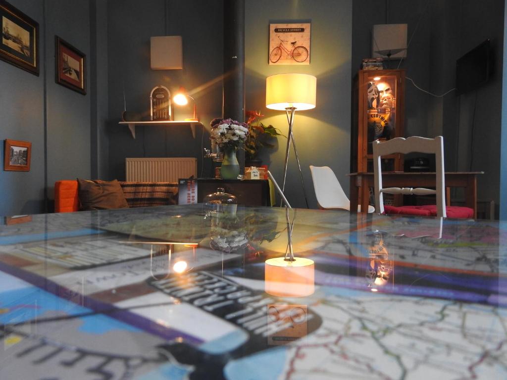 a glass table with a remote control on top of it at Hull Trinity Backpackers in Hull