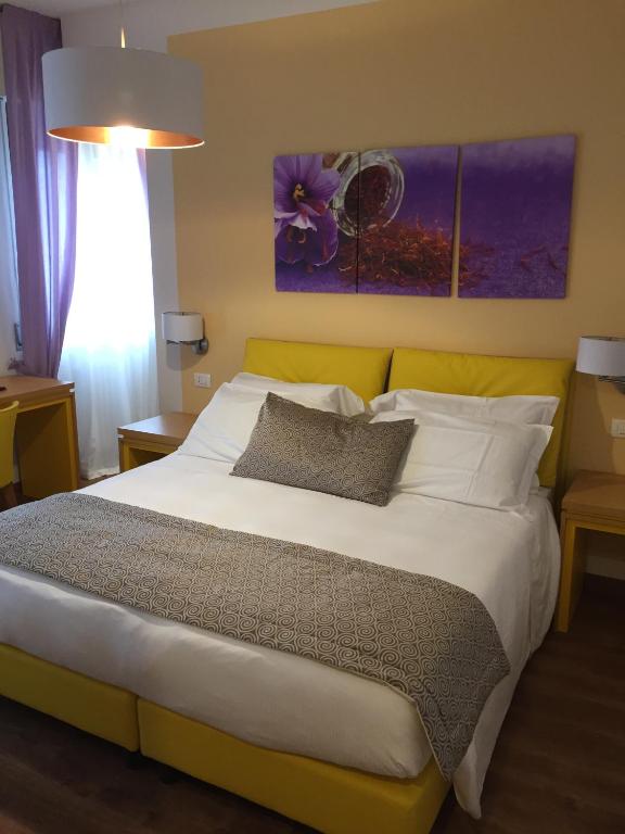 Postel nebo postele na pokoji v ubytování La Gustea Hotel & Cucina