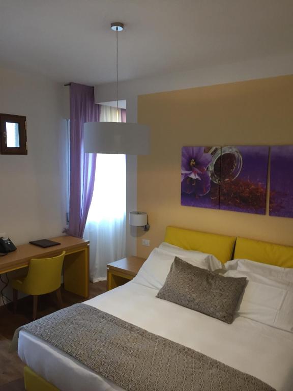 Postel nebo postele na pokoji v ubytování La Gustea Hotel & Cucina