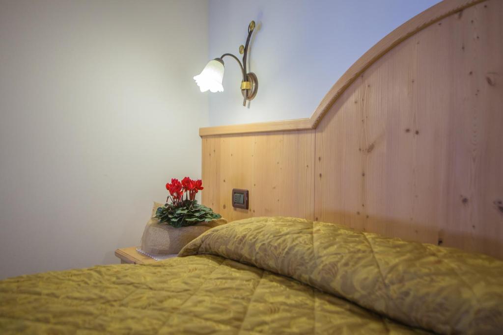 Postel nebo postele na pokoji v ubytování Hotel Bertoldi