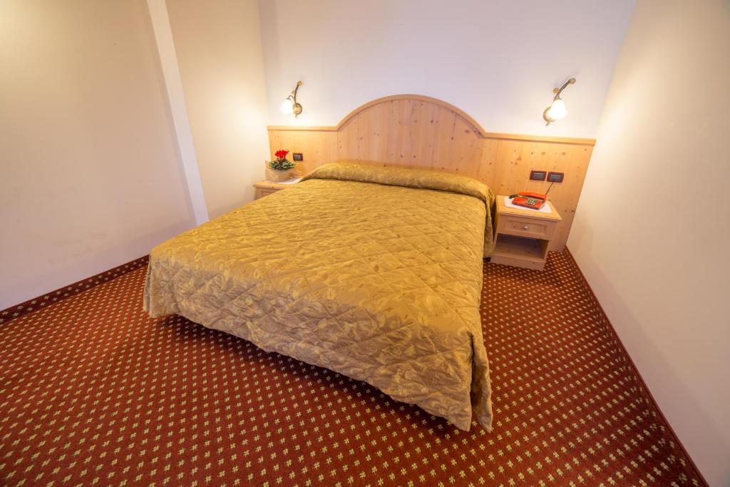 Postel nebo postele na pokoji v ubytování Hotel Bertoldi