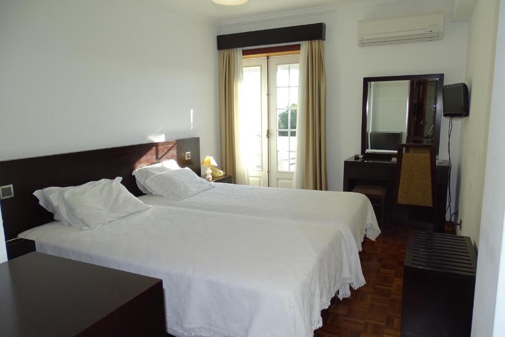 Postel nebo postele na pokoji v ubytování Hotel Mira Rio