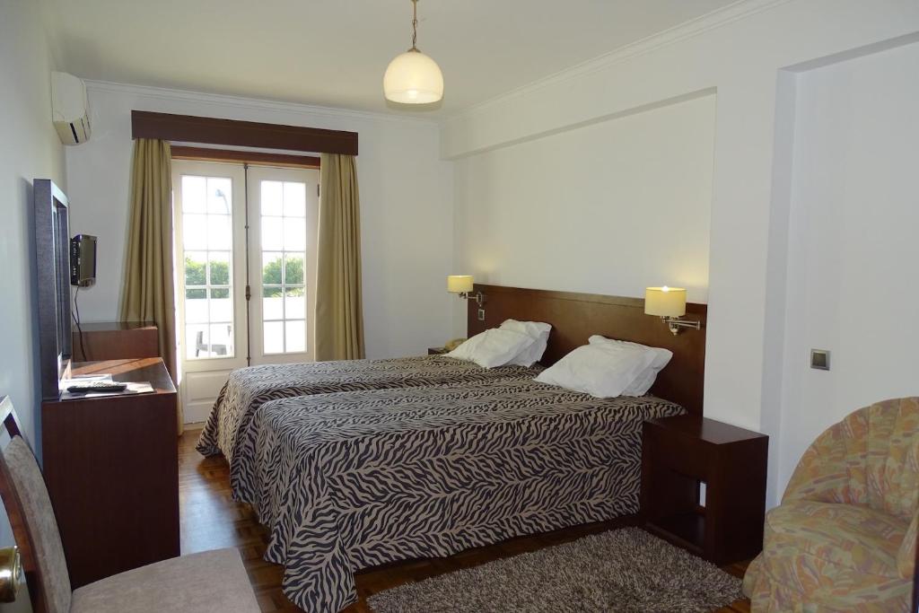 Postel nebo postele na pokoji v ubytování Hotel Mira Rio