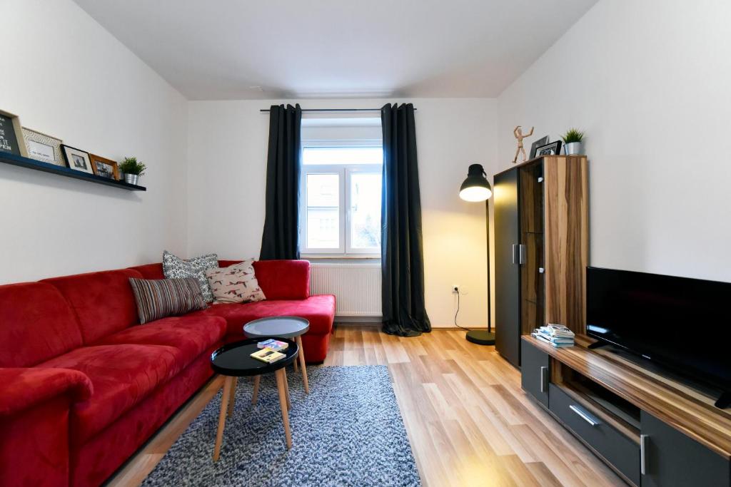 Televízia a/alebo spoločenská miestnosť v ubytovaní Block Apartment Maks