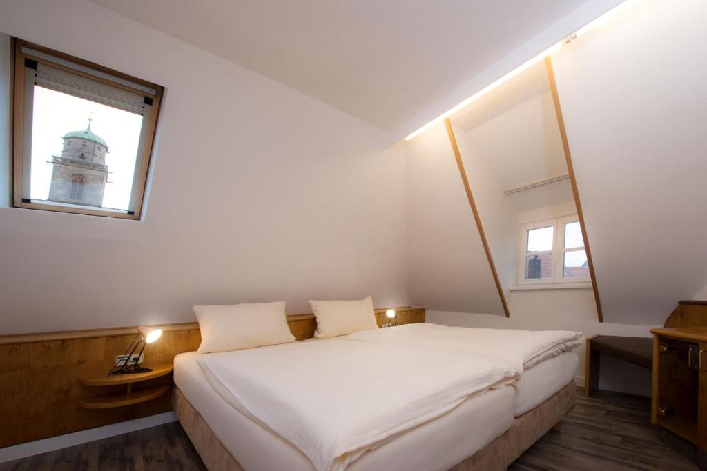 Postel nebo postele na pokoji v ubytování Hotel PIAZZA