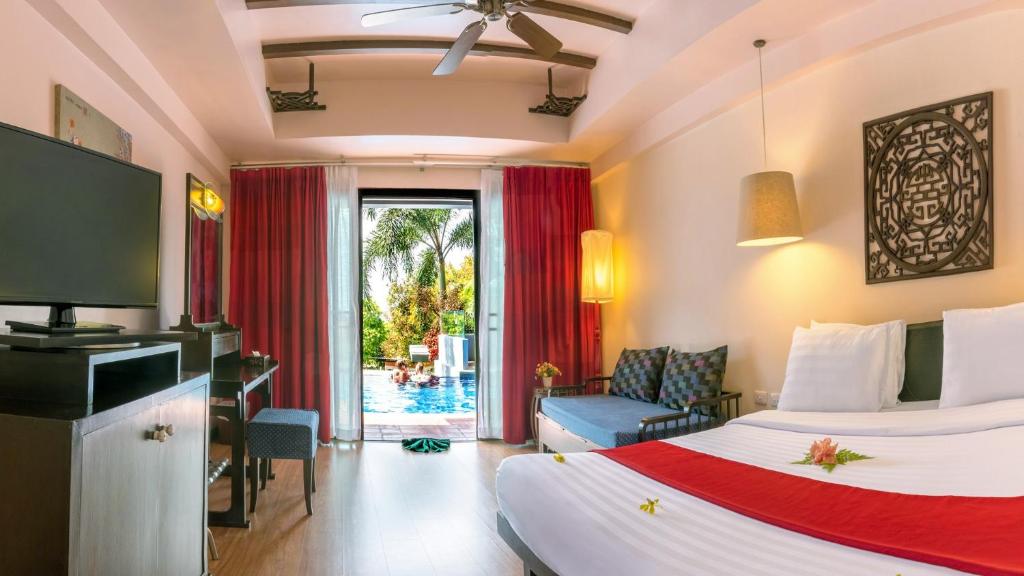 Postel nebo postele na pokoji v ubytování Krabi Chada Resort - SHA Plus