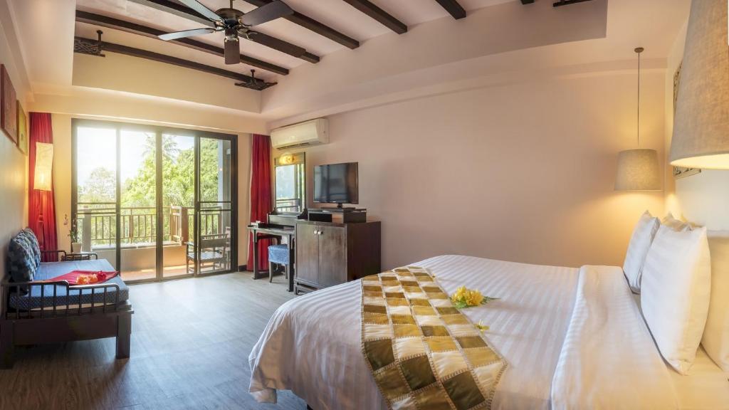 Postel nebo postele na pokoji v ubytování Krabi Chada Resort - SHA Plus