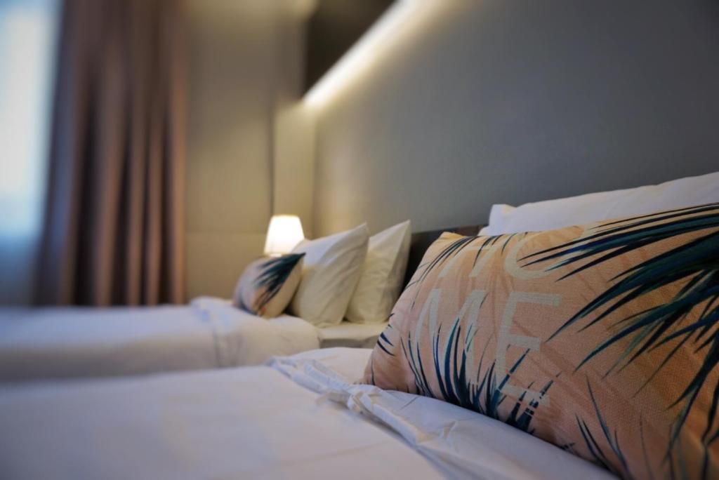Postel nebo postele na pokoji v ubytování Hotel Gaia 95