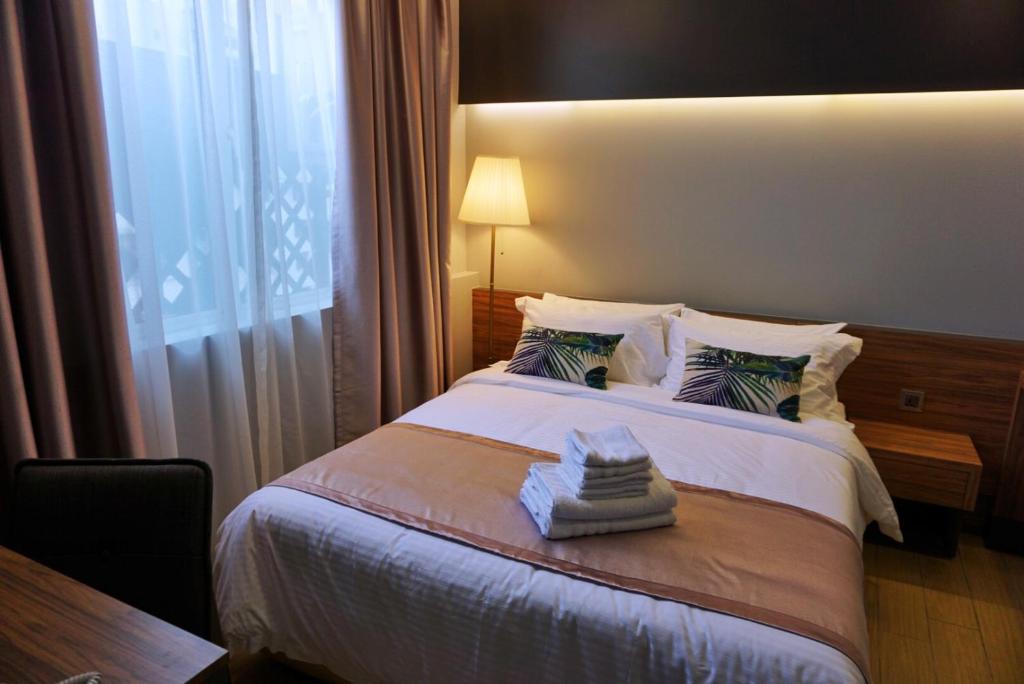 Postel nebo postele na pokoji v ubytování Hotel Gaia 95