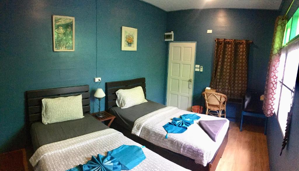 Postel nebo postele na pokoji v ubytování Blue Chang House