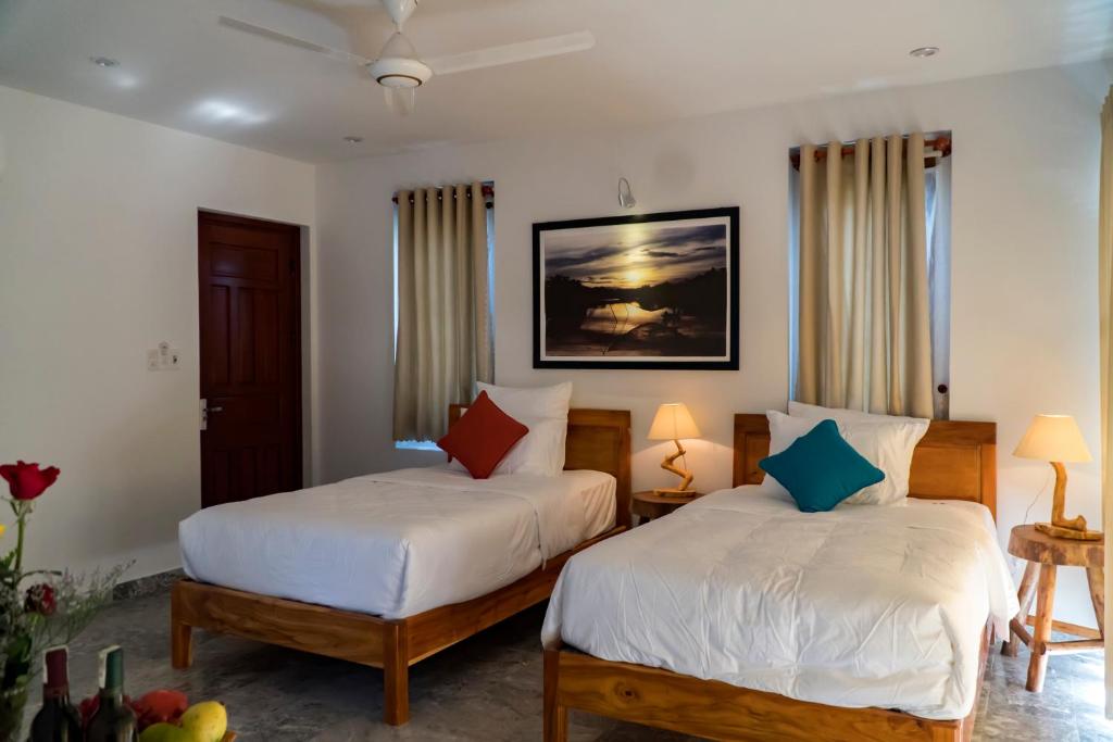 Postel nebo postele na pokoji v ubytování Louis Villa Hoi An