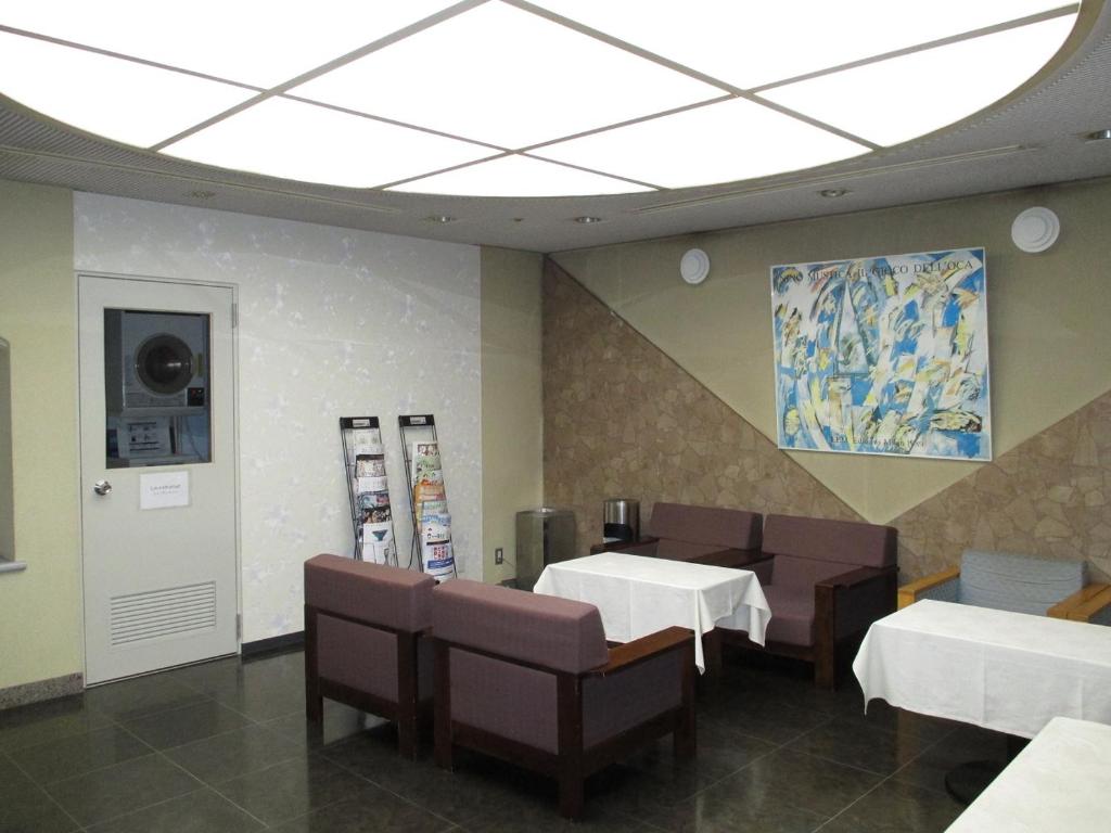 Postel nebo postele na pokoji v ubytování Pulses Inn Kyoto