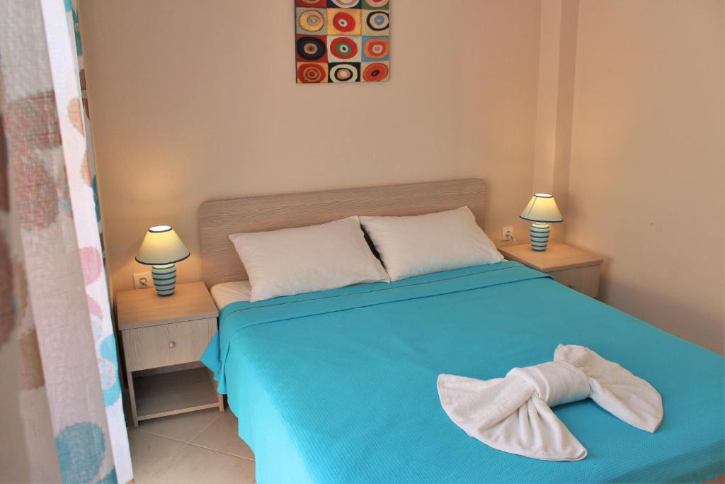 A bed or beds in a room at Theodora Villas