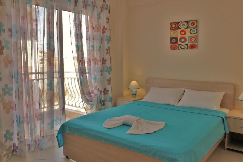 A bed or beds in a room at Theodora Villas