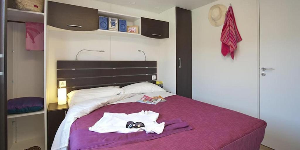 Postel nebo postele na pokoji v ubytování Camping villaggio L'Ultima spiaggia