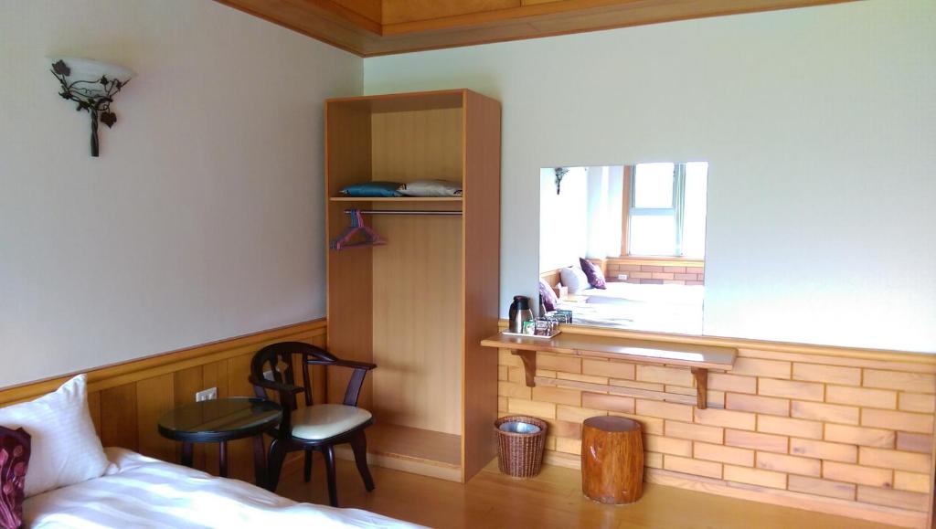 Postel nebo postele na pokoji v ubytování Seasons Inn