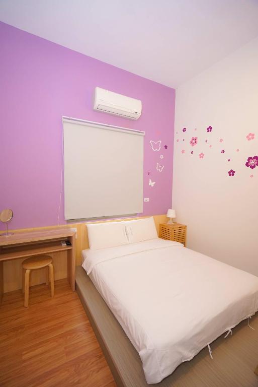 Postel nebo postele na pokoji v ubytování Colorful B&B
