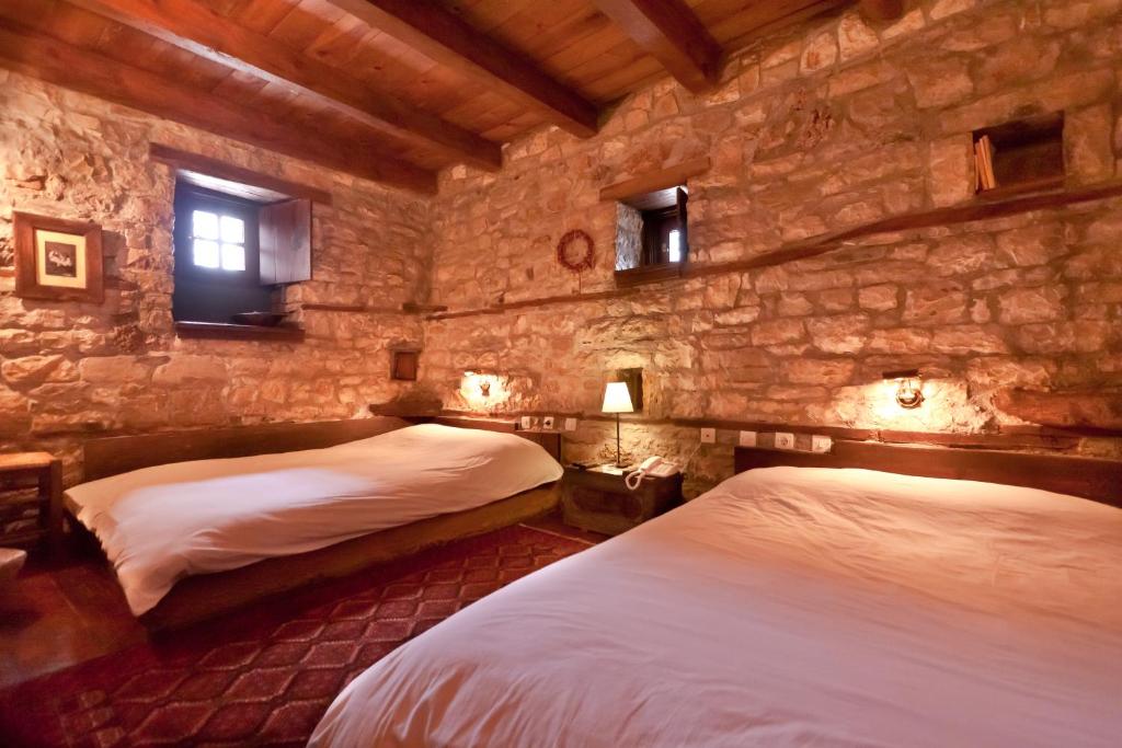 A bed or beds in a room at Arhontiko Aristis