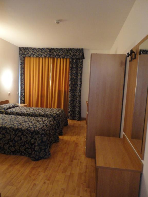 Postel nebo postele na pokoji v ubytování Hotel La Carica
