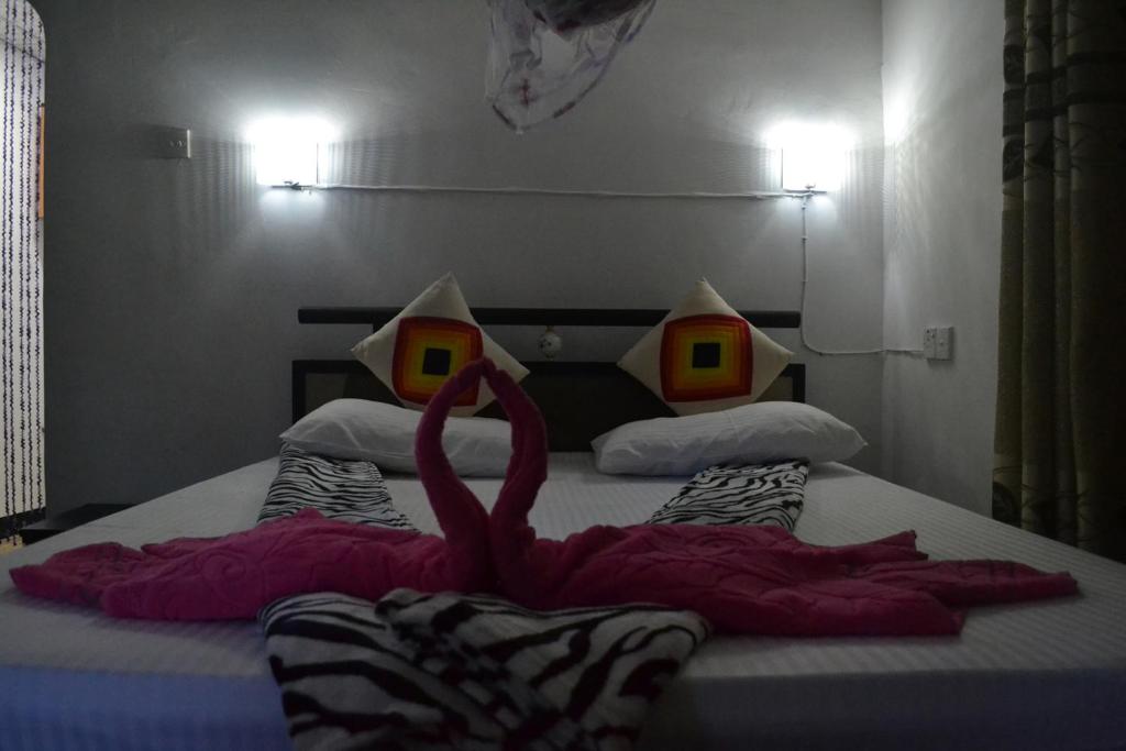Postel nebo postele na pokoji v ubytování Ella Fresh Point Homestay