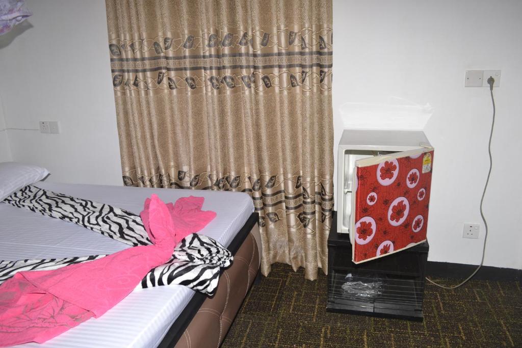 Postel nebo postele na pokoji v ubytování Ella Fresh Point Homestay
