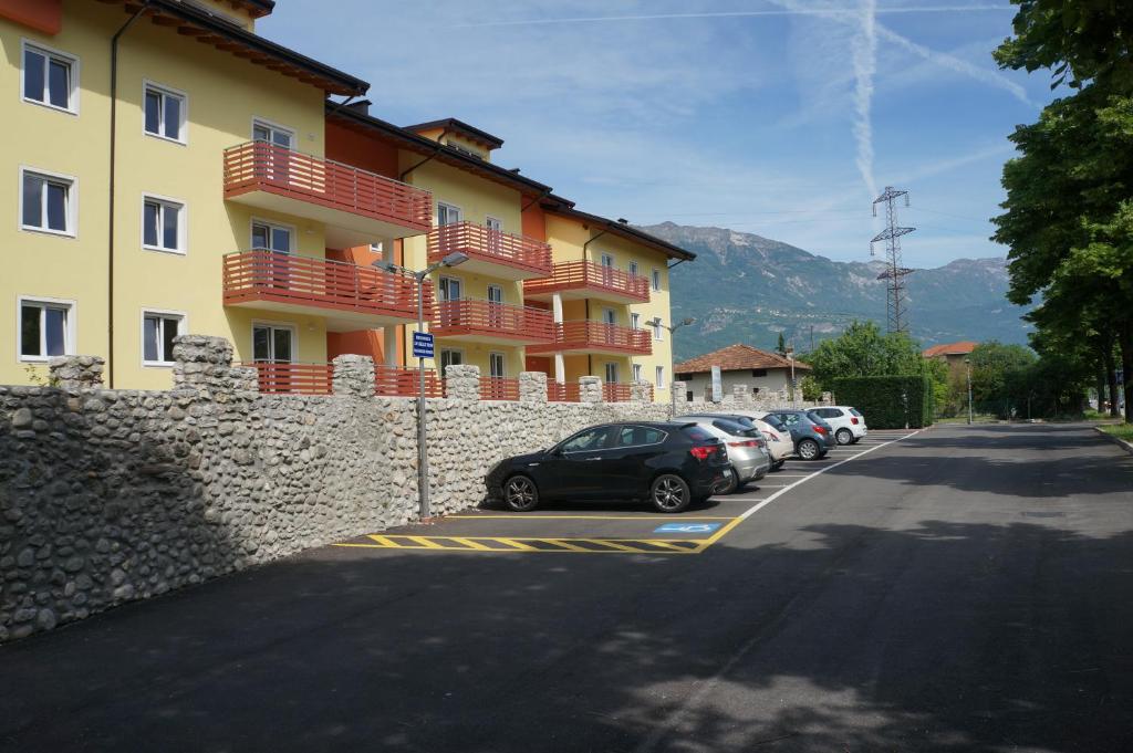 a row of cars parked in front of a building at Cà delle Rose in Rovereto