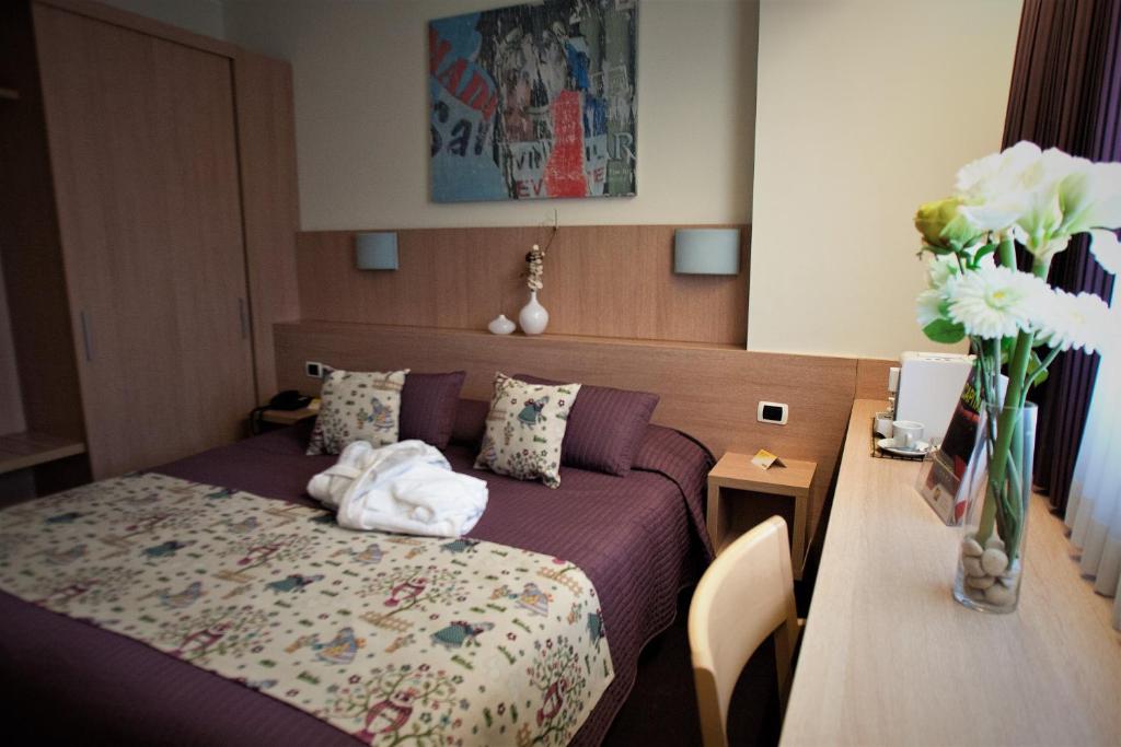 Postel nebo postele na pokoji v ubytování Hotel Capital