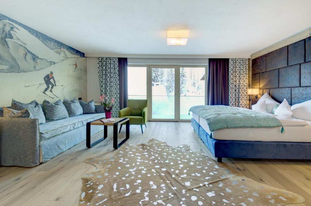 A bed or beds in a room at Hotel Kendler