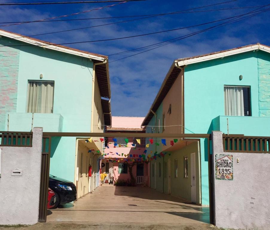 a street in a town with blue buildings at Casa na Vila do Chicão in Aracaju