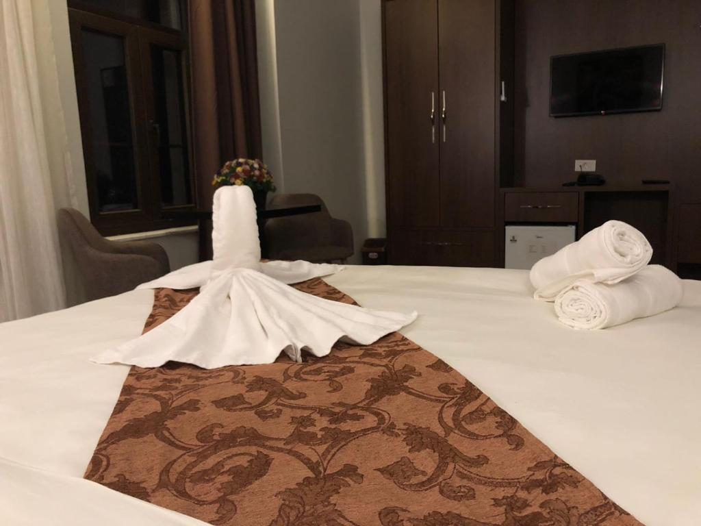 Postel nebo postele na pokoji v ubytování AEN Hotel-Old City