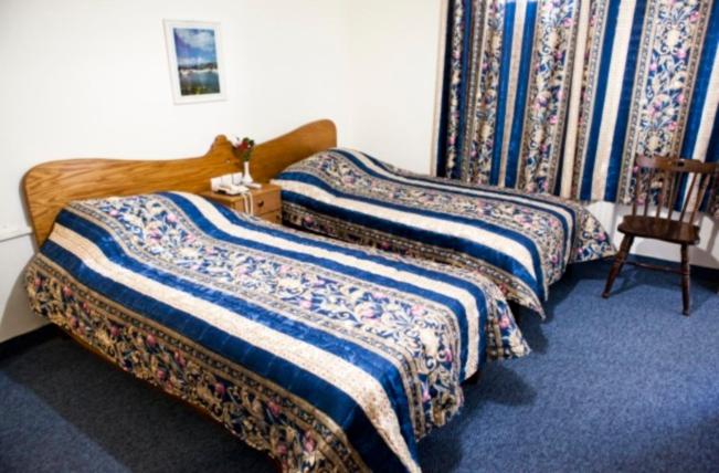 Cama o camas de una habitación en Victoria Hotel