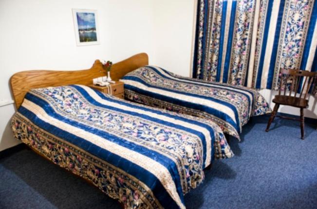 Postel nebo postele na pokoji v ubytování Victoria Hotel
