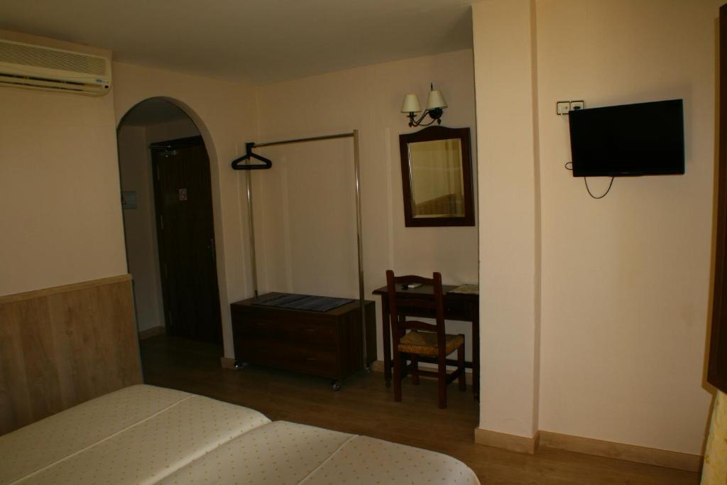 Cama o camas de una habitación en Hotel Rural Huerta del Laurel