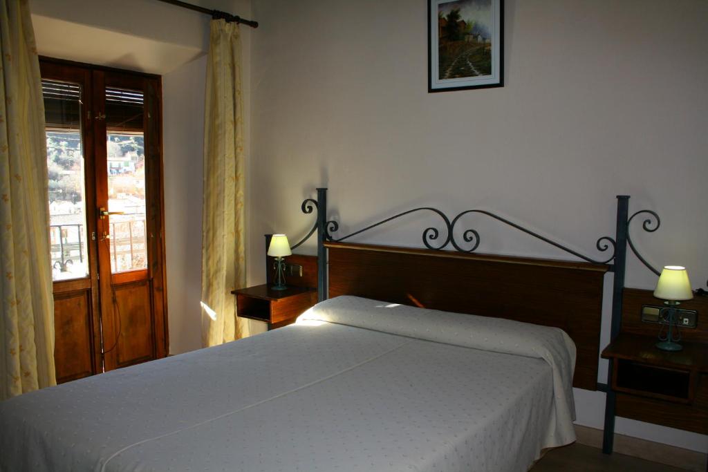 Cama o camas de una habitación en Hotel Rural Huerta del Laurel