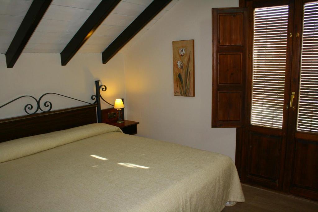 Cama o camas de una habitación en Hotel Rural Huerta del Laurel
