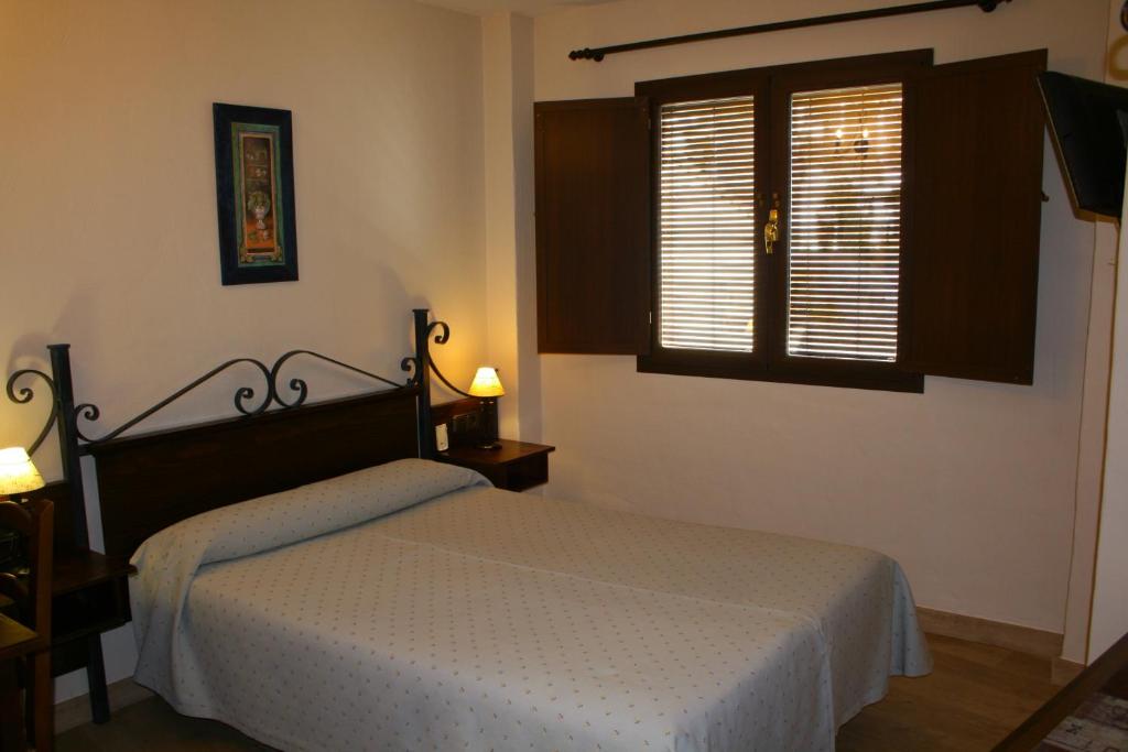 Cama o camas de una habitación en Hotel Rural Huerta del Laurel