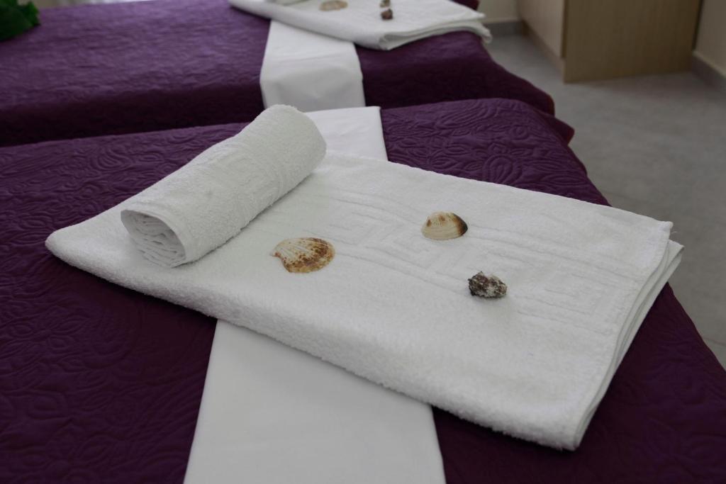 Postel nebo postele na pokoji v ubytování Kentrikon Suites
