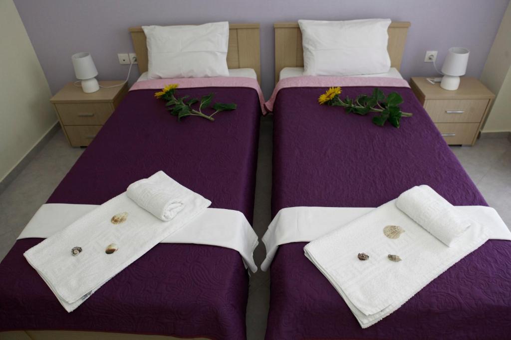 Postel nebo postele na pokoji v ubytování Kentrikon Suites