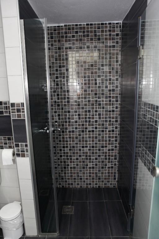 Koupelna v ubytování Kentrikon Suites