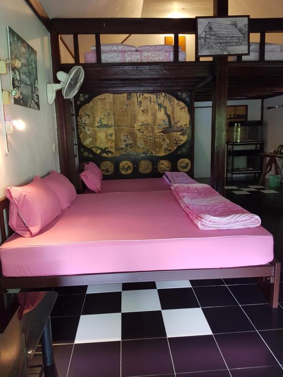 Postel nebo postele na pokoji v ubytování Ban Sabai Sabai Guest House