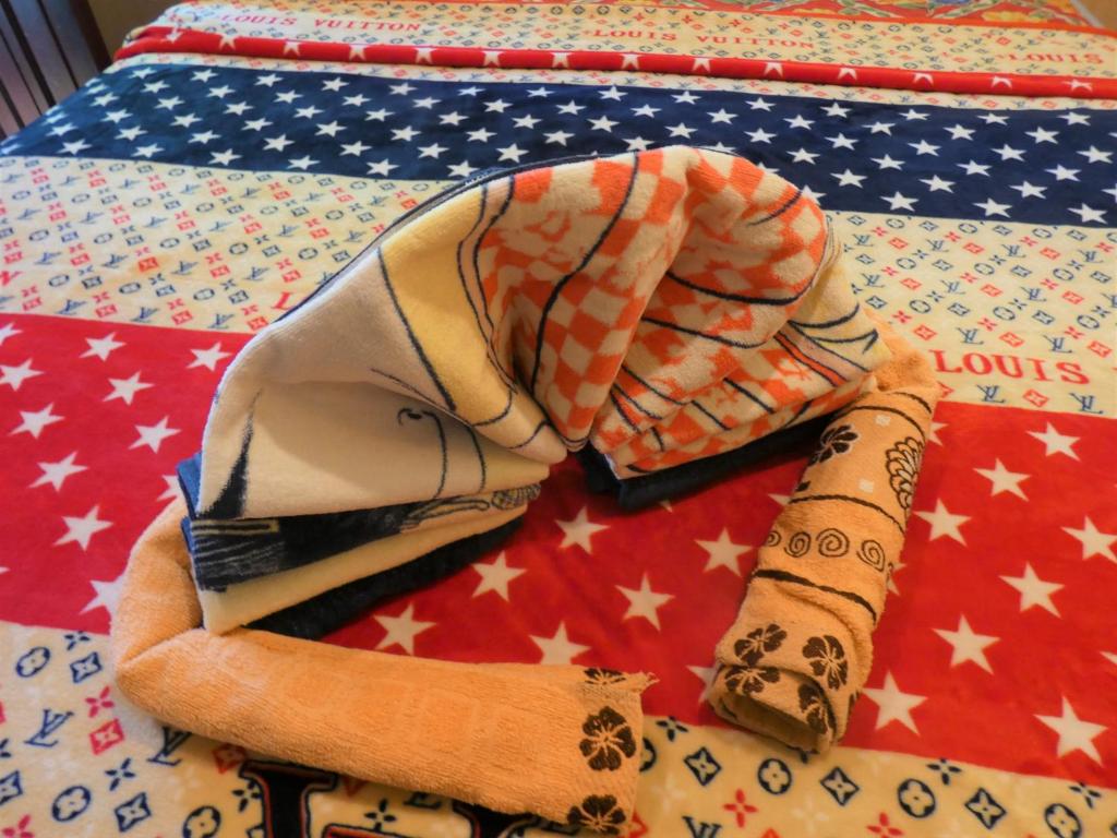 a group of ties on a table with an american flag at Pich Guesthouse in Phnom Penh