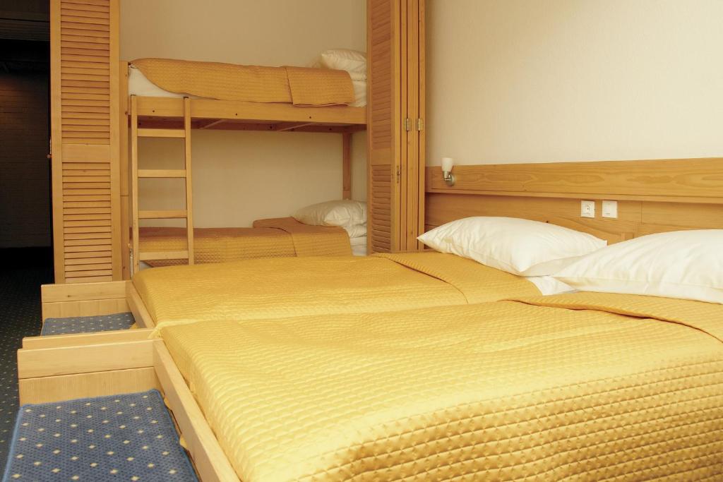 Postel nebo postele na pokoji v ubytování Hotel Špik